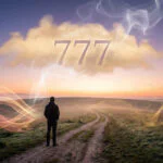 A person stands on a winding path at dawn, facing a horizon with '777' glowing in the sky. Symbolic lights of love, prosperity, and spiritual awakening surround them.