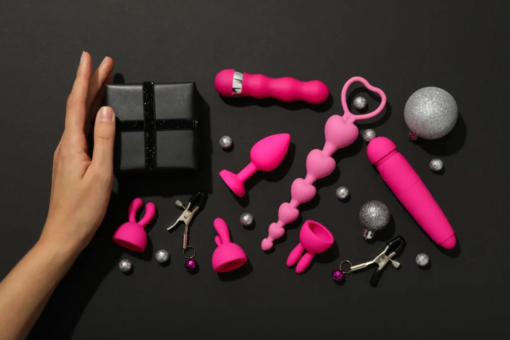 sex-toys-with-christmas-decorations-dark-background